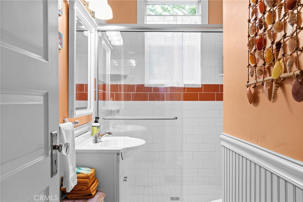 740 Orient Street Chico, CA 95928 - Photo 25 of 48 a bathroom with a sink a mirror and a shower
