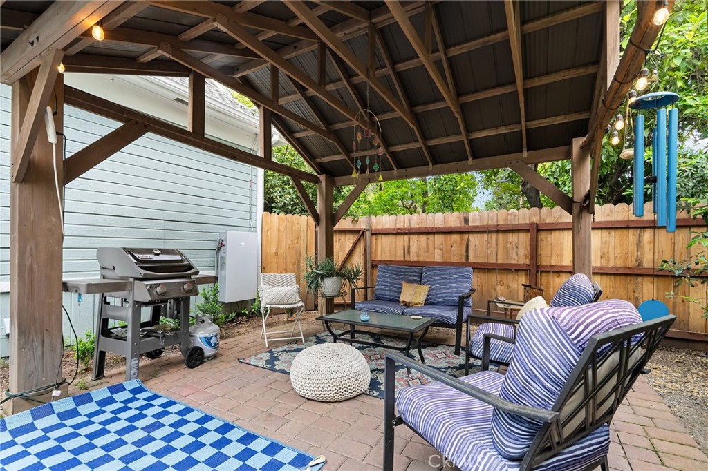740 Orient Street Chico, CA 95928 - Photo 38 of 48 a view of a patio with couches chairs and a table and chairs with wooden floor