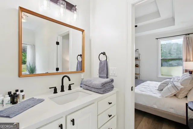 a en suite bathroom with sink and mirror