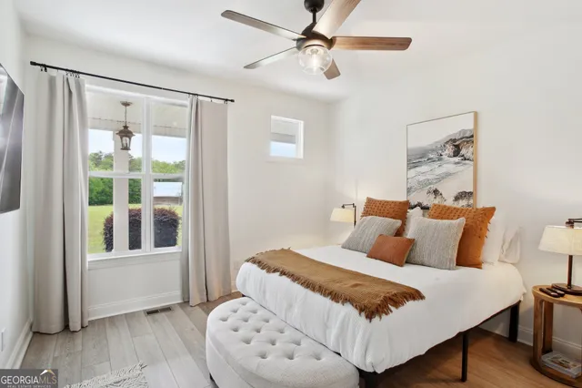 a bedroom with a bed and a window