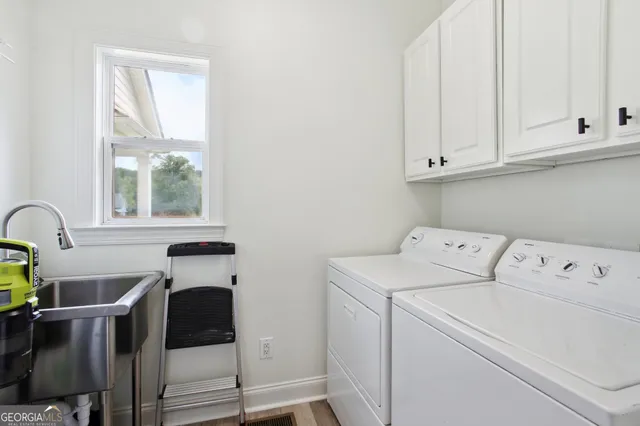 a utility room with dryer and washer