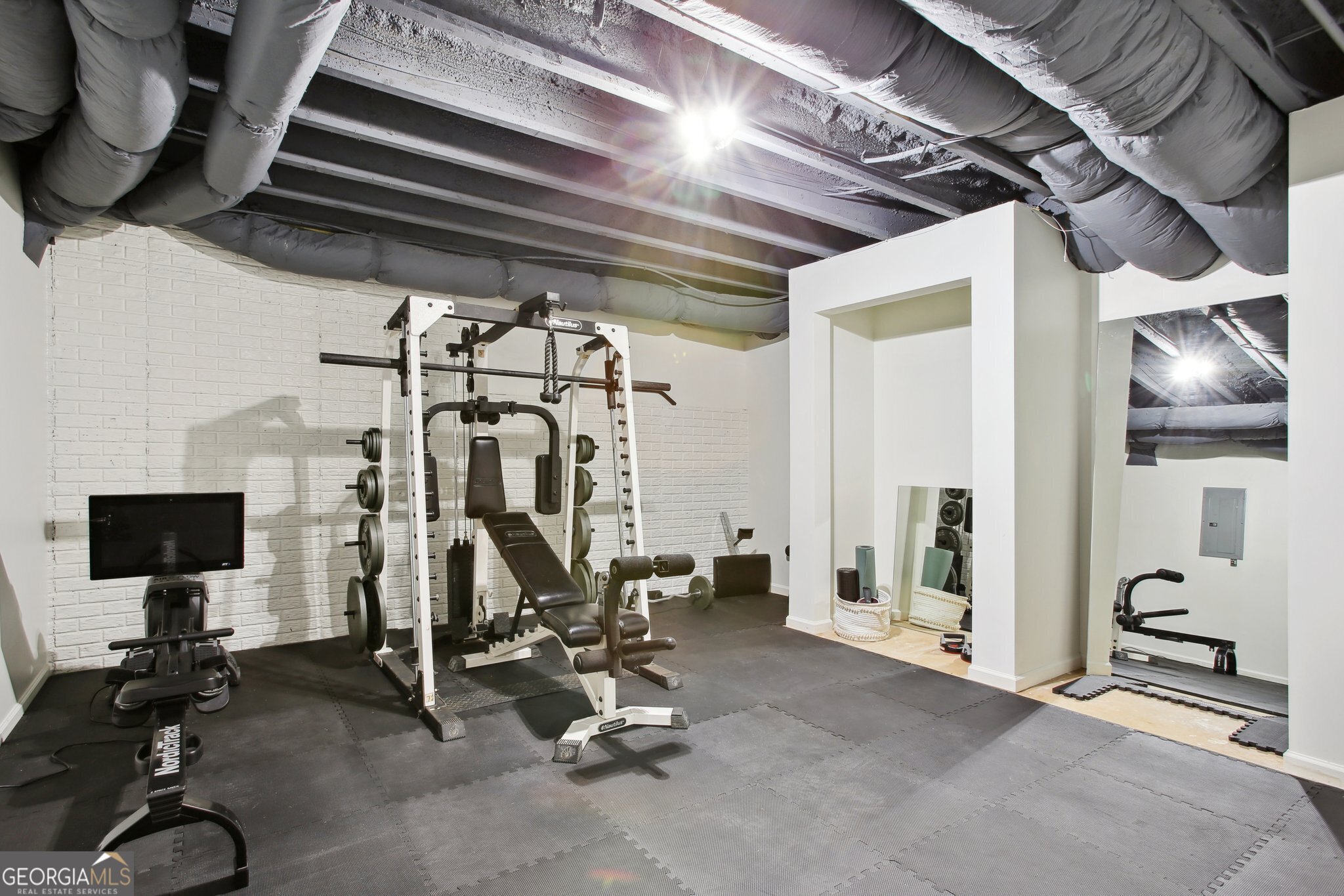 524 Forrest Avenue Fayetteville, GA 30214 - Photo 19 of 30 a view of a room with gym equipment