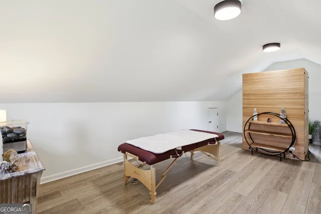 a living room with a bed and furniture