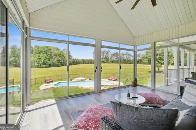 a living room filled with furniture and a table