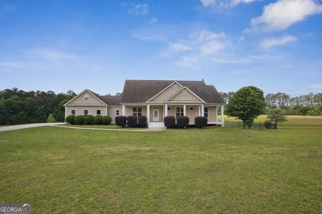 a front view of a house with garden