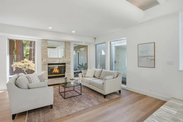 a large kitchen with kitchen island granite countertop a stove and a center island