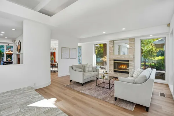 a kitchen with stainless steel appliances granite countertop a stove and cabinets