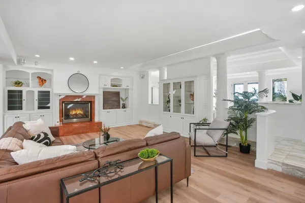 a view of a dining room with furniture and wooden floor