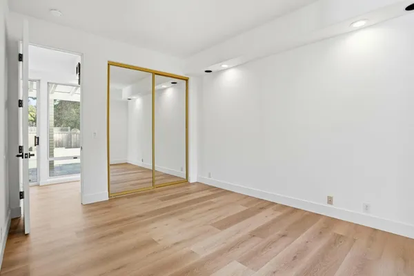 a bathroom with a granite countertop sink a mirror and vanity