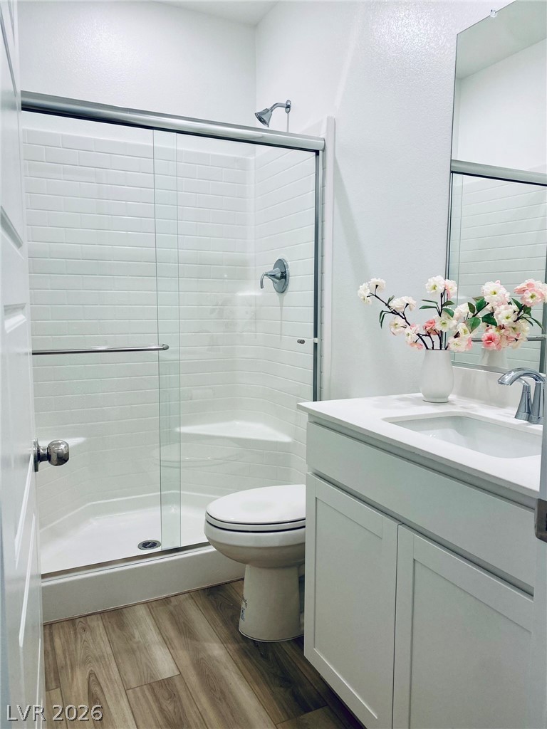 4457 Sawyer Ridge Street Las Vegas, NV 89147 - Photo 4 of 32 This modern bathroom features clean lines and a functional design, perfect for daily routines.