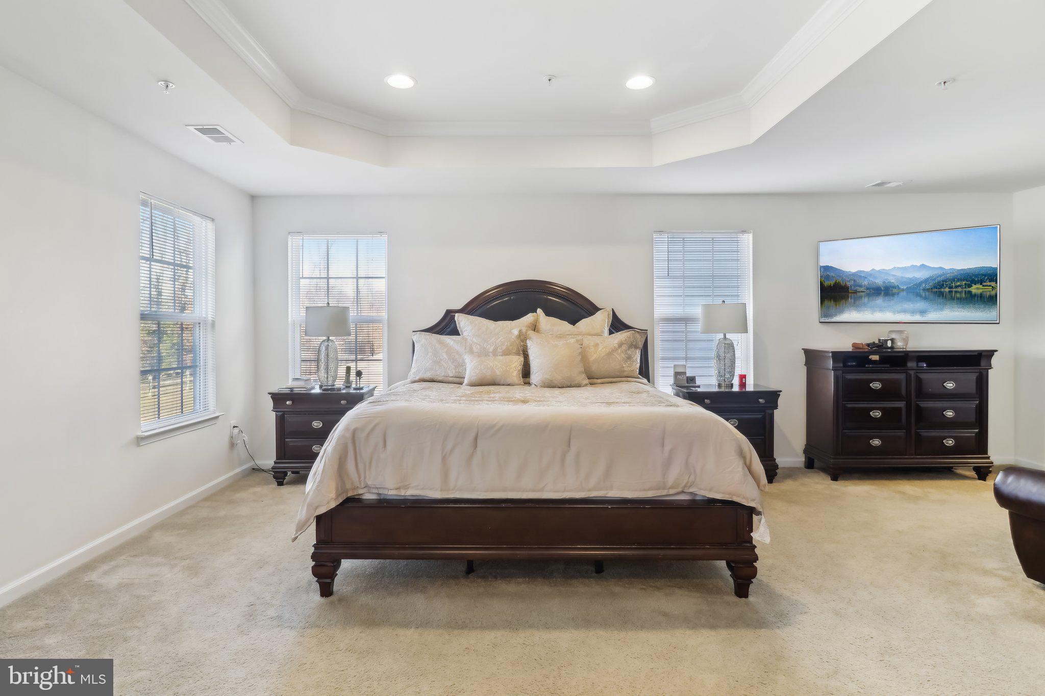 14013 Wheel Wright Place Accokeek, MD 20607 - Photo 12 of 38 a spacious bedroom with a bed a couch and large window