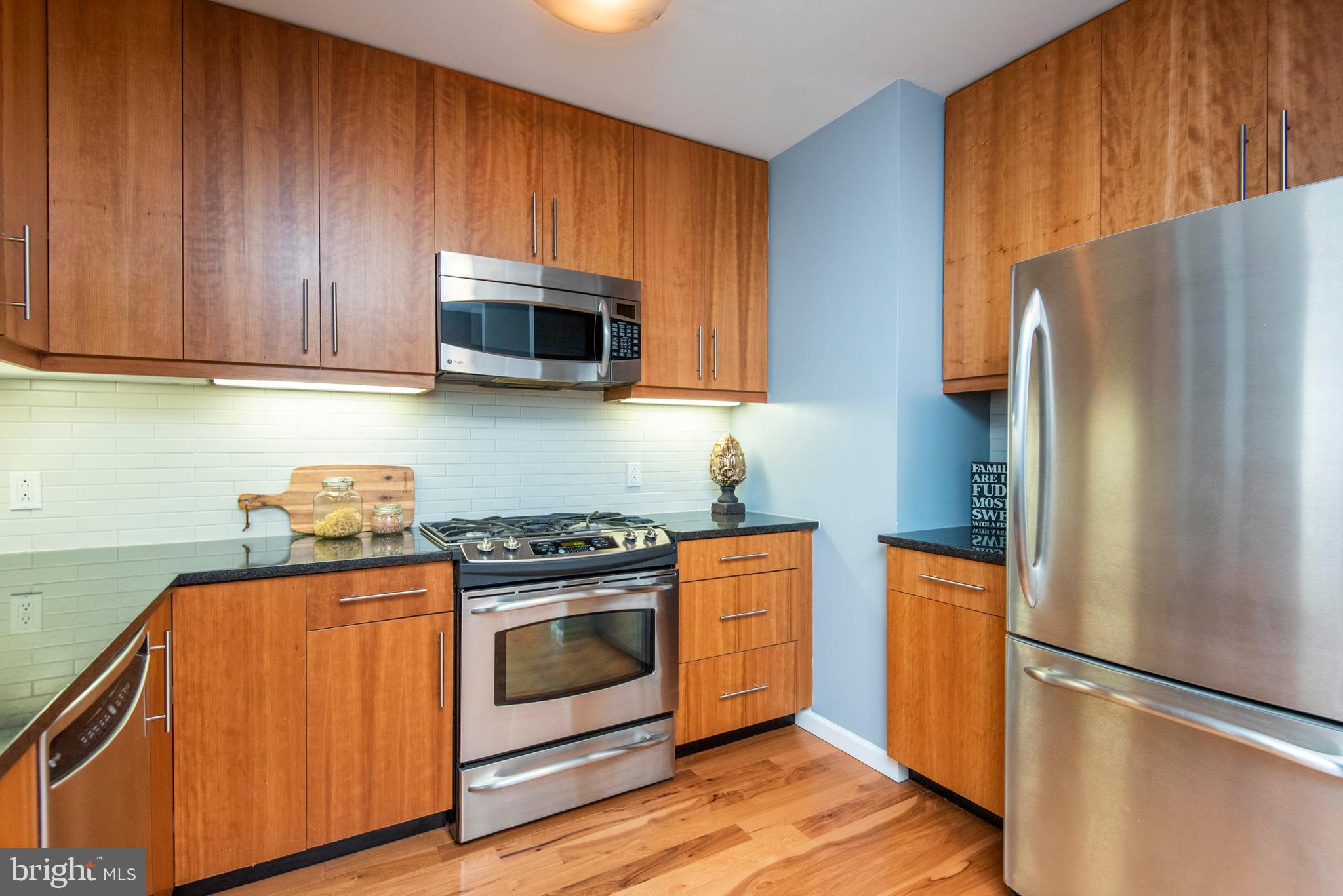 1425 Locust Street, Unit 4F Philadelphia, PA 19102 - Photo 11 of 34 a kitchen with a stove microwave and refrigerator