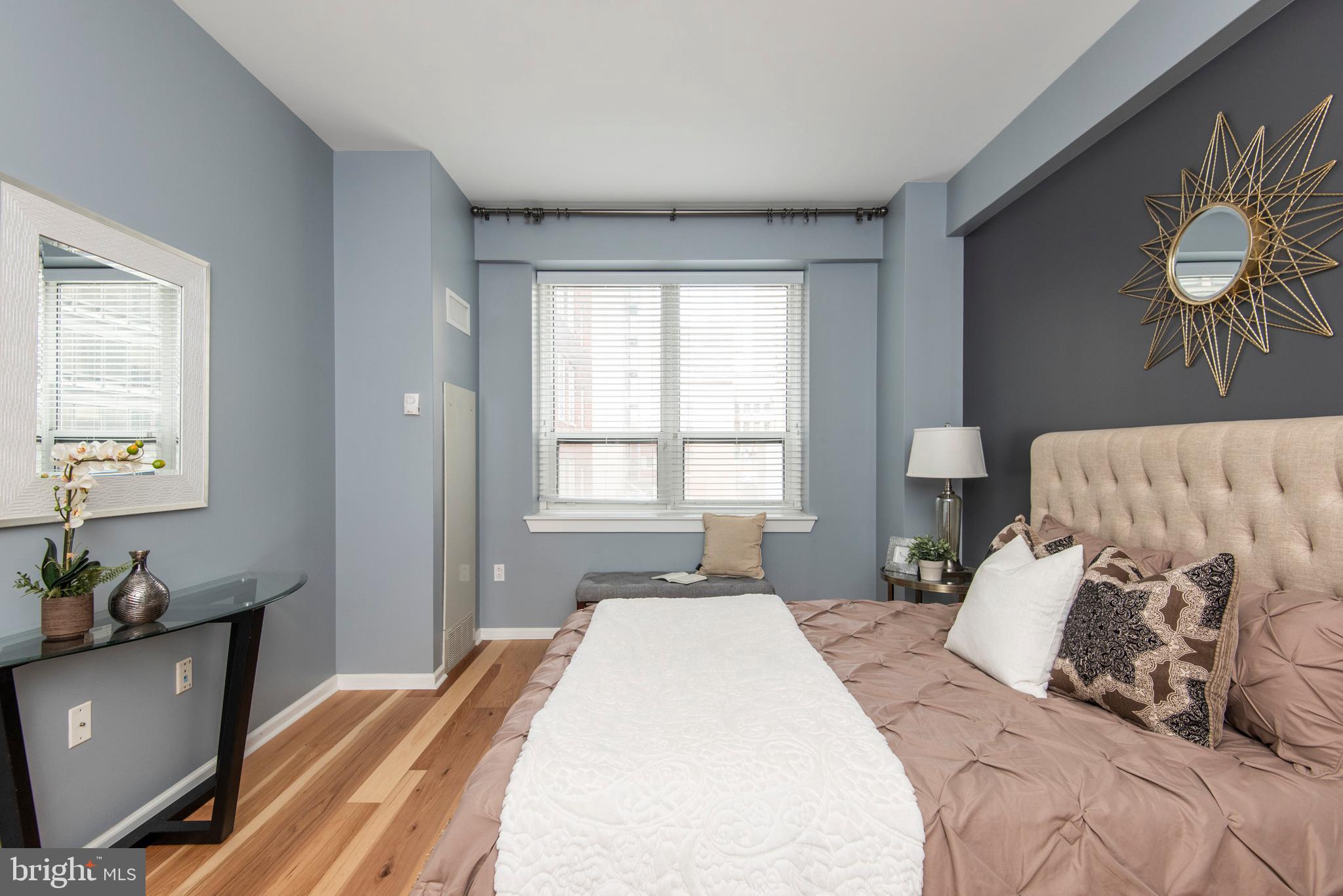 1425 Locust Street, Unit 4F Philadelphia, PA 19102 - Photo 22 of 34 a bedroom with a bed and window