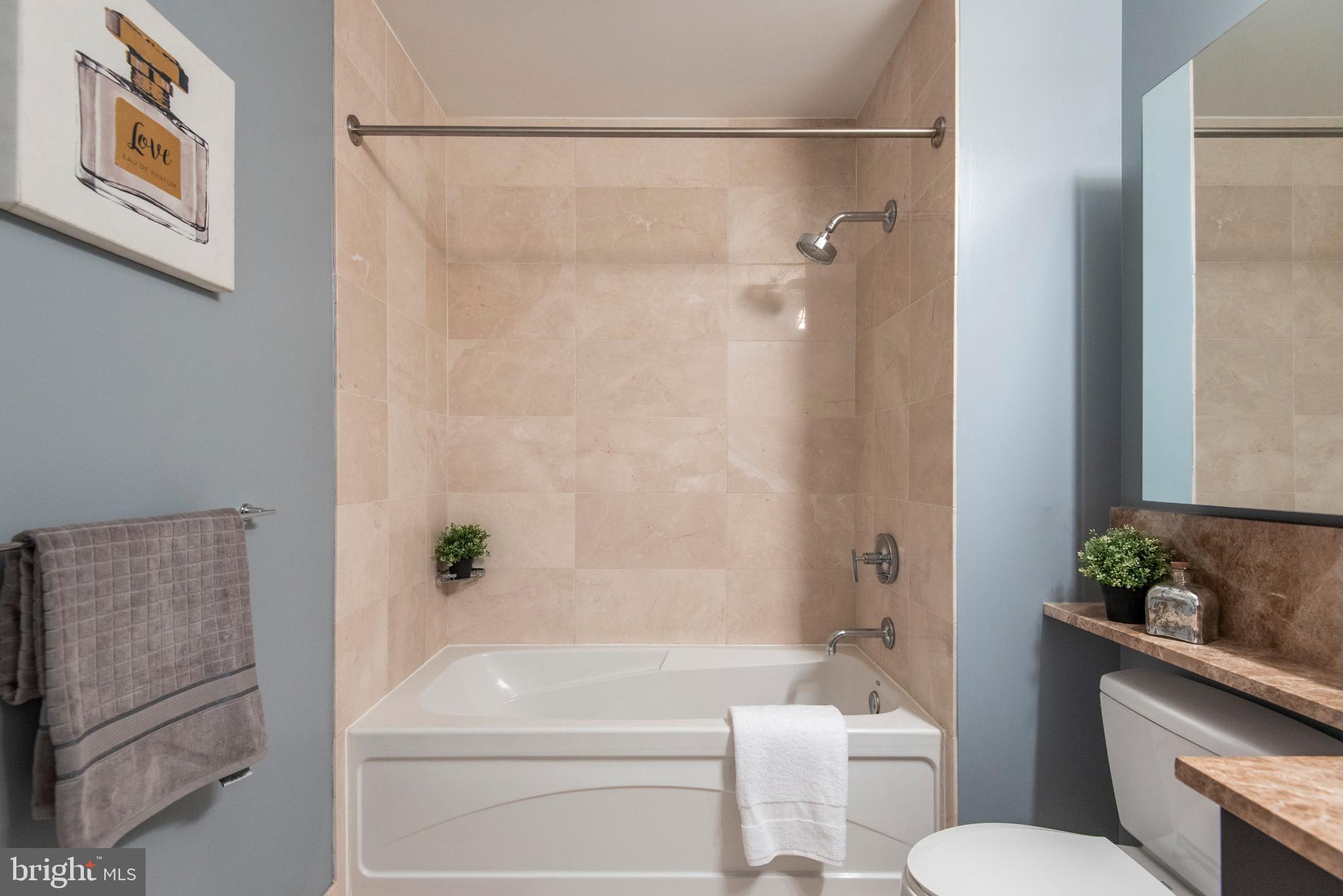 1425 Locust Street, Unit 4F Philadelphia, PA 19102 - Photo 25 of 34 a bathroom with a sink a toilet and shower