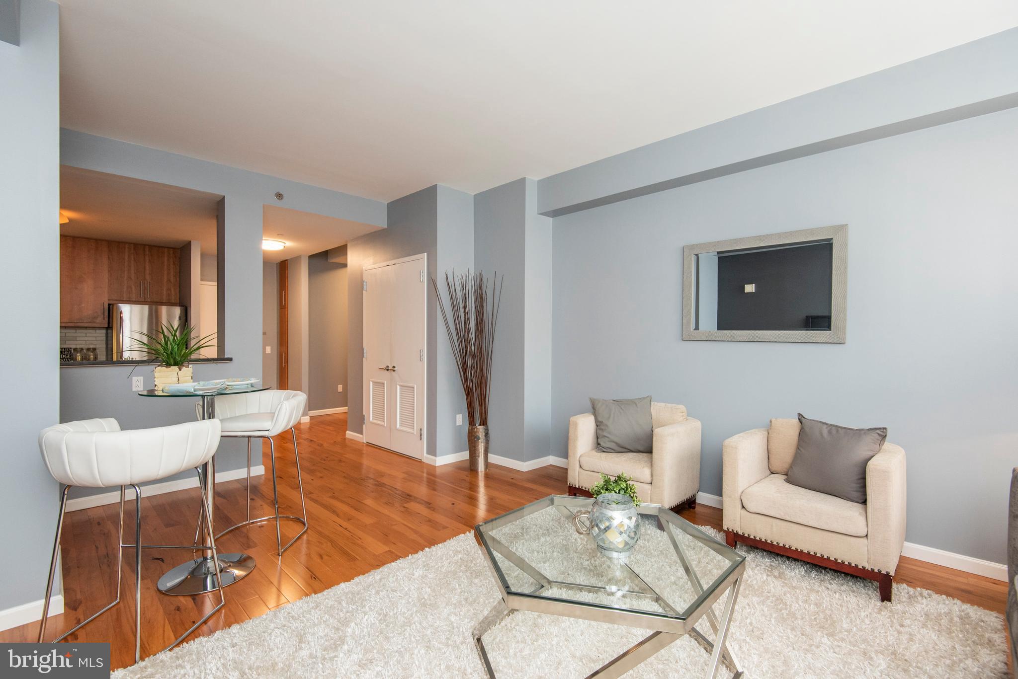 1425 Locust Street, Unit 4F Philadelphia, PA 19102 - Photo 5 of 34 a living room with furniture and a wooden floor