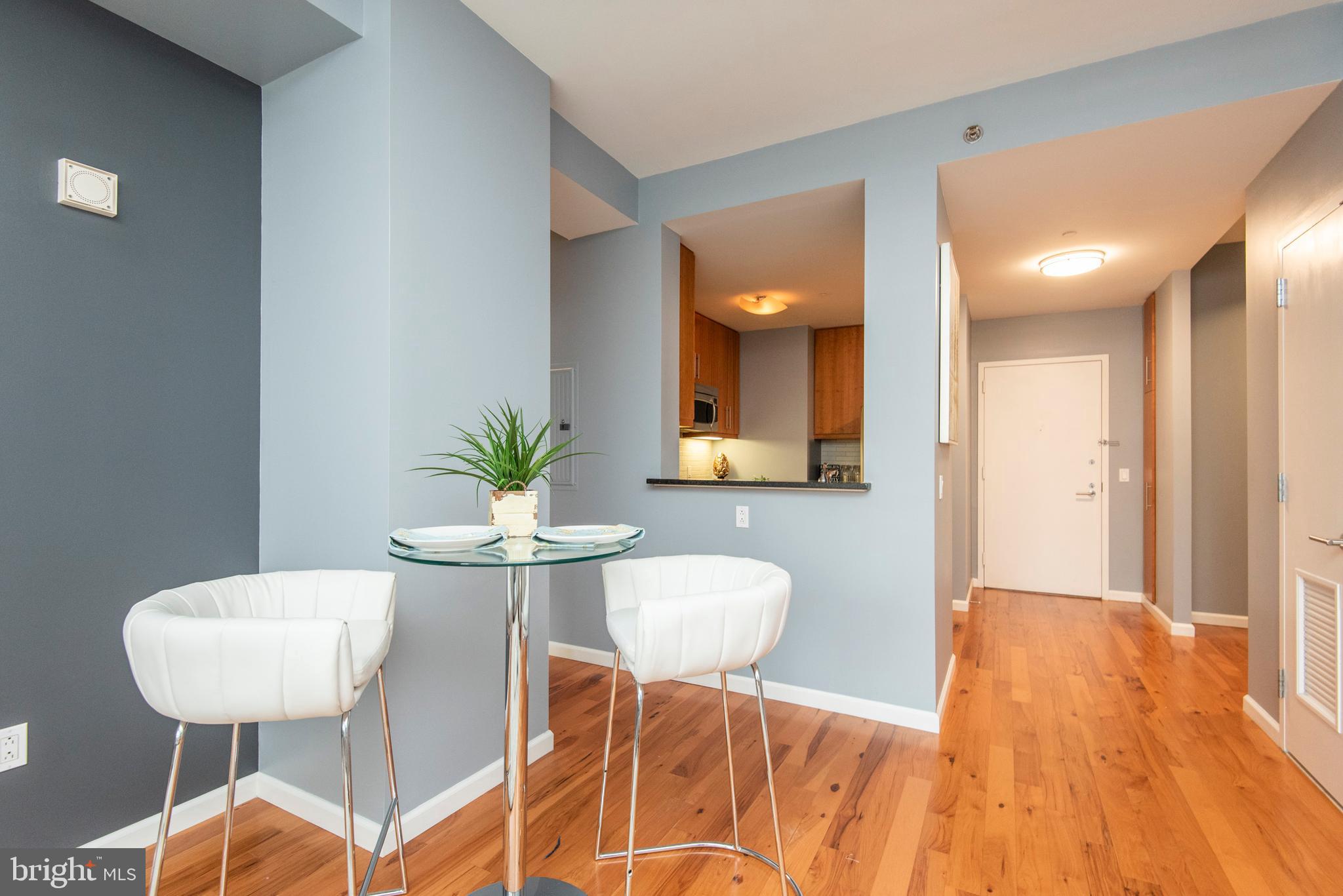 1425 Locust Street, Unit 4F Philadelphia, PA 19102 - Photo 8 of 34 a dining room with furniture and wooden floor