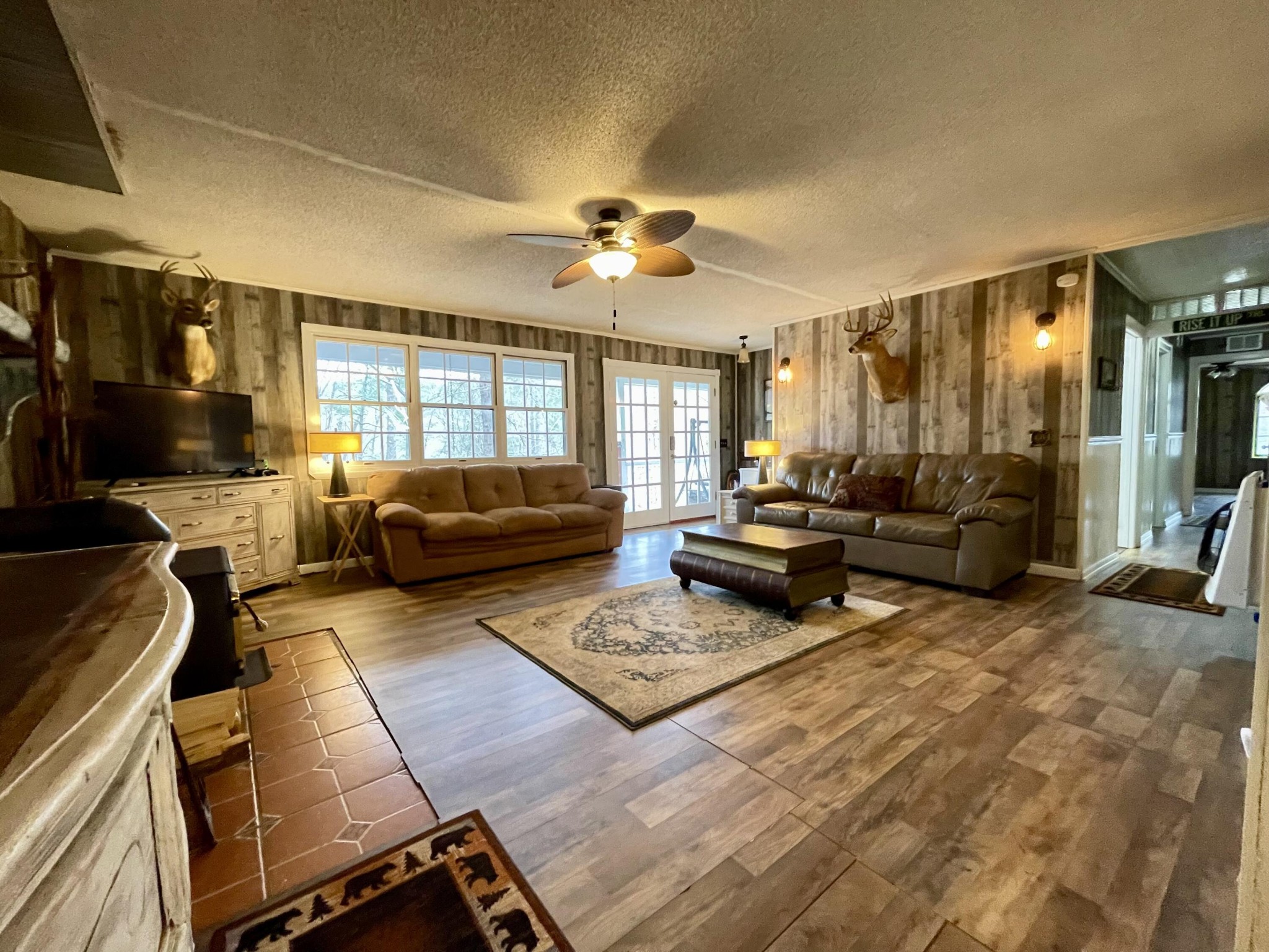 1522 Turkey Creek Road Tellico Plains, TN 37385 - Photo 10 of 34 a living room with furniture fireplace and a large window