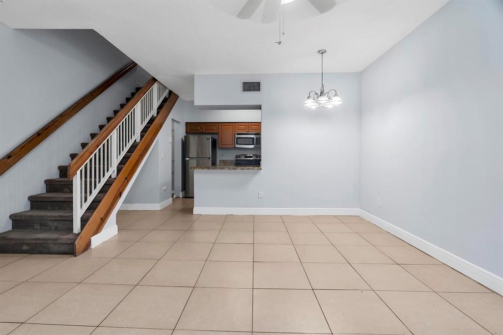 18352 Northwest 68th Avenue, Unit M Hialeah, FL 33015 - Photo 13 of 28 a view of an entryway and workspace