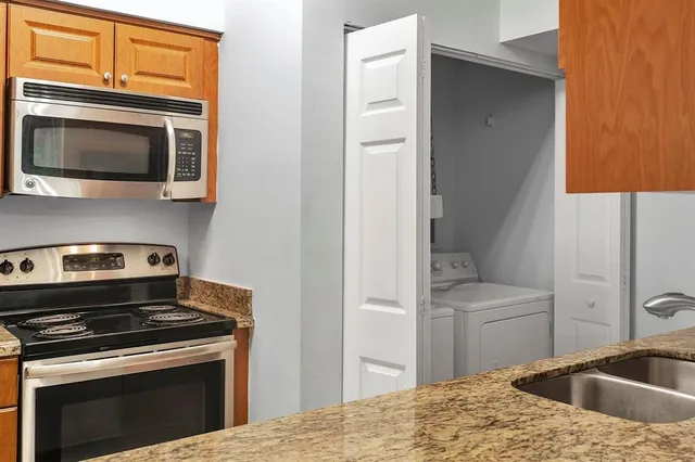 a kitchen with a stove and a microwave
