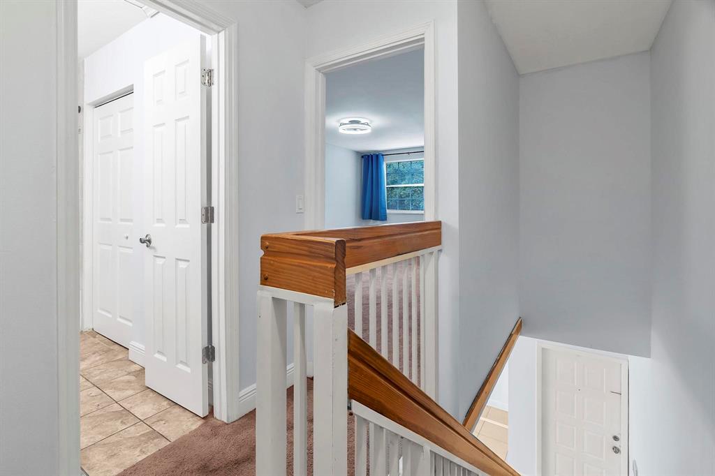 18352 Northwest 68th Avenue, Unit M Hialeah, FL 33015 - Photo 20 of 28 a view of a hallway with a hallway
