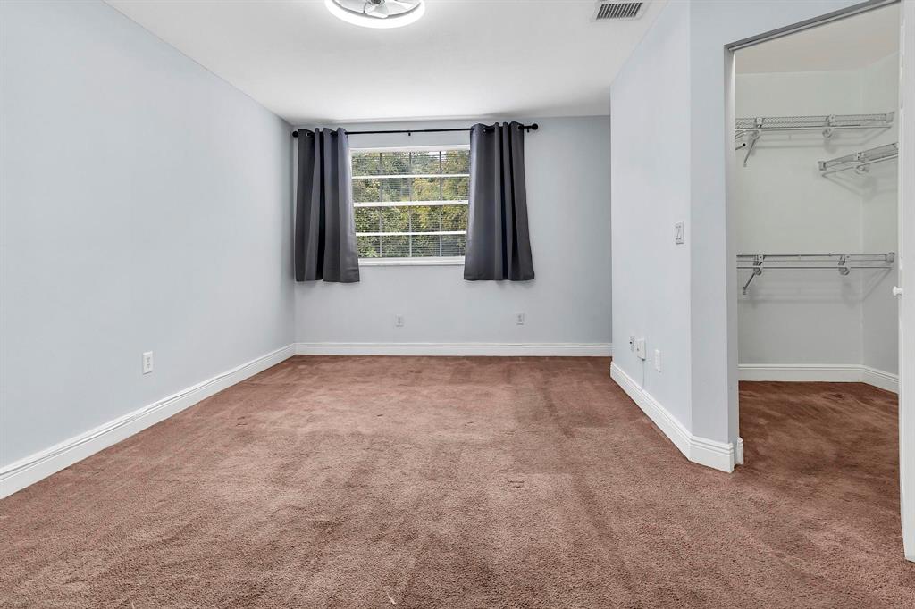 18352 Northwest 68th Avenue, Unit M Hialeah, FL 33015 - Photo 24 of 28 an empty room with windows