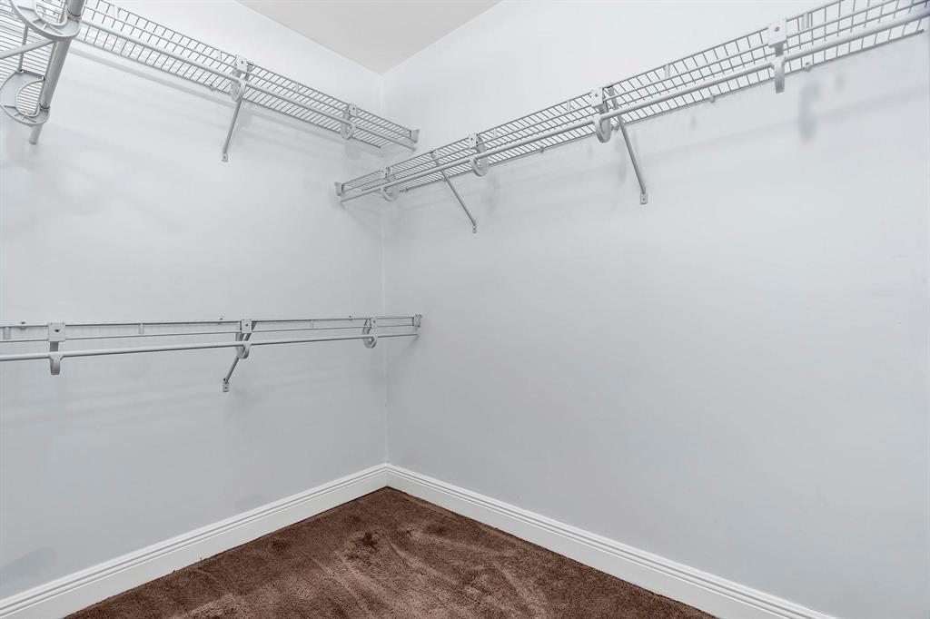 18352 Northwest 68th Avenue, Unit M Hialeah, FL 33015 - Photo 28 of 28 a view of a room with racks on the wall