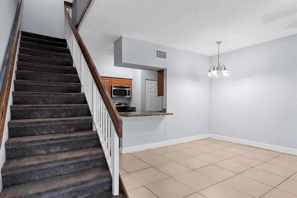 18352 Northwest 68th Avenue, Unit M Hialeah, FL 33015 - Photo 5 of 28 a view of entryway and hall with wooden floor