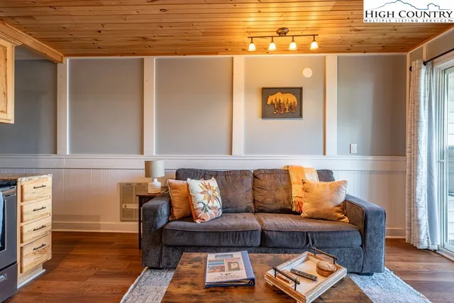 a blue couch sitting on a table and a couch