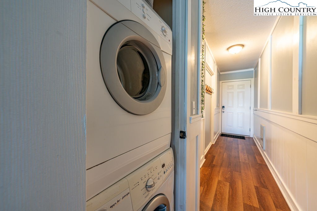 301 Pinnacle Inn Road, Unit 3204B Beech Mountain, NC 28604 - Photo 16 of 33 a view of a hallway with washer and dryer