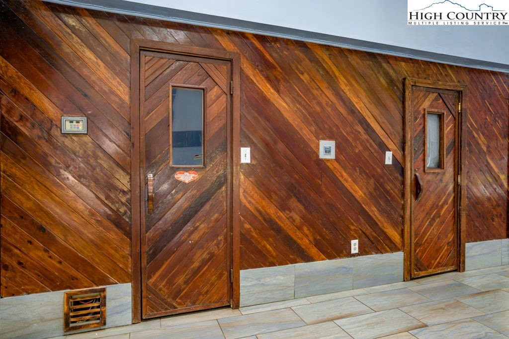 301 Pinnacle Inn Road, Unit 3204B Beech Mountain, NC 28604 - Photo 23 of 33 a view of a house with a large tree