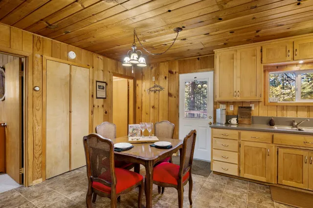 a living room with lots of furniture and kitchen view