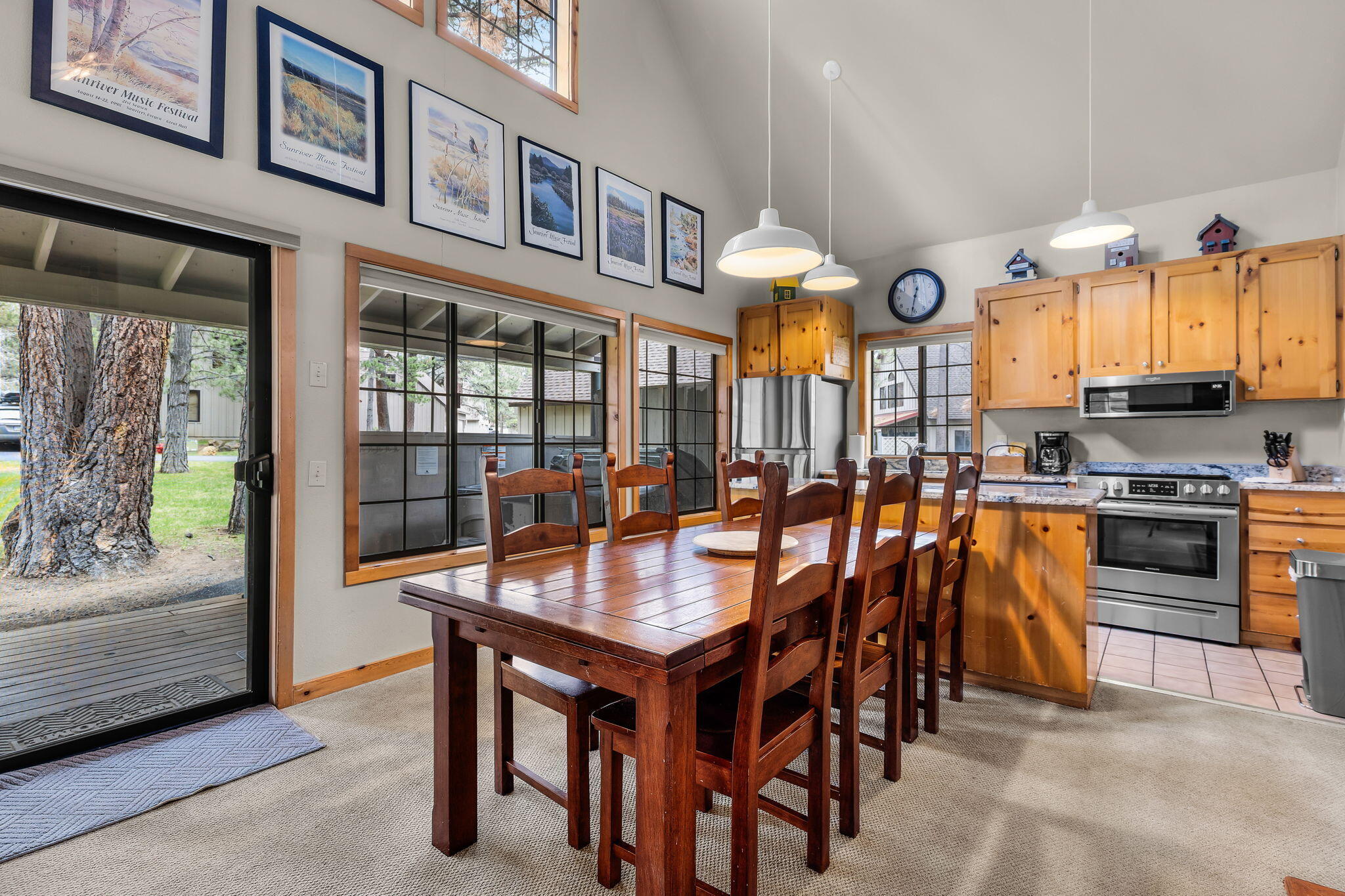 57505 Circle 4 Cabin Road, Unit 29 Sunriver, OR 97707 - Photo 12 of 35 a dining hall with stainless steel appliances granite countertop a stove and a dining table view