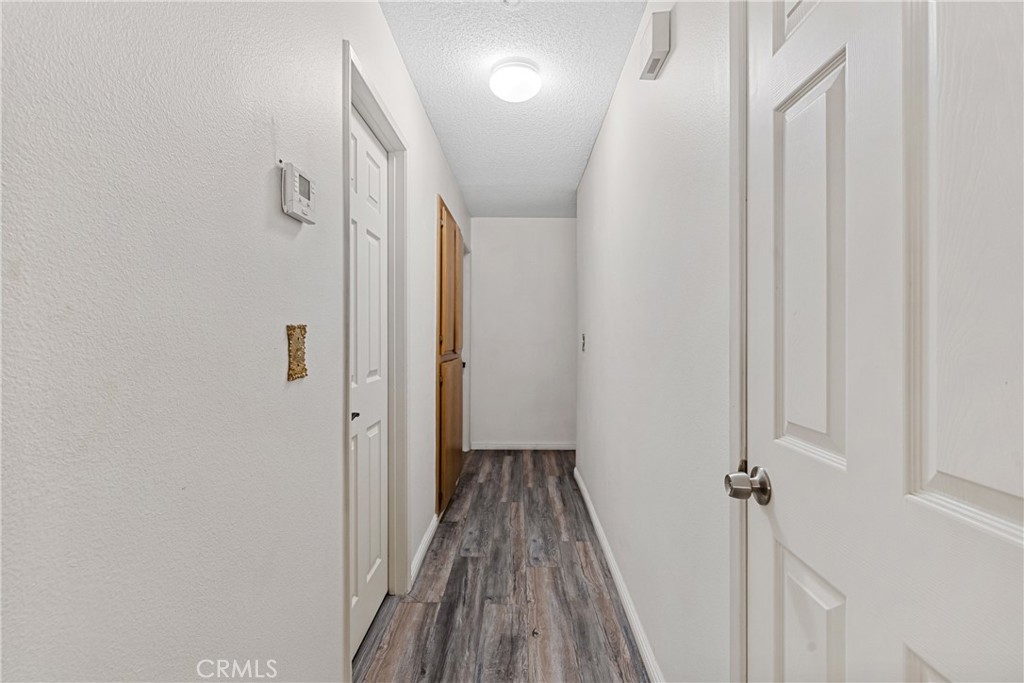 2906 Summer Set Circle Banning, CA 92220 - Photo 16 of 43 a view of a hallway with wooden floor and staircase