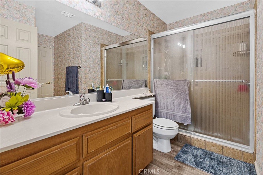2906 Summer Set Circle Banning, CA 92220 - Photo 18 of 43 a bathroom with a sink toilet and shower