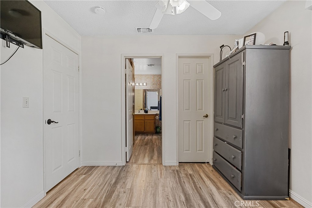 2906 Summer Set Circle Banning, CA 92220 - Photo 20 of 43 a view of a hallway view with wooden floor and staircase