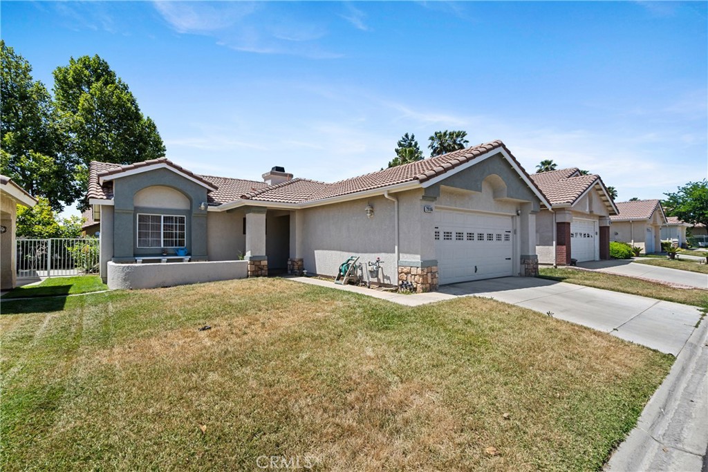 2906 Summer Set Circle Banning, CA 92220 - Photo 2 of 43 a view of a house with a yard and large tree