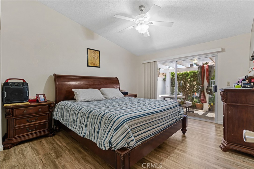 2906 Summer Set Circle Banning, CA 92220 - Photo 22 of 43 a bedroom with a bed and a chandelier