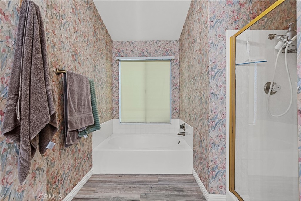 2906 Summer Set Circle Banning, CA 92220 - Photo 25 of 43 a bathroom with a bathtub and a shower