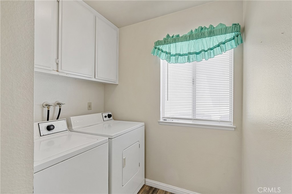 2906 Summer Set Circle Banning, CA 92220 - Photo 7 of 43 a bathroom with a sink a vanity and a window