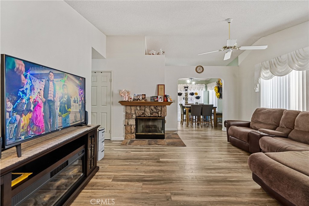 2906 Summer Set Circle Banning, CA 92220 - Photo 8 of 43 a living room with furniture and a fireplace