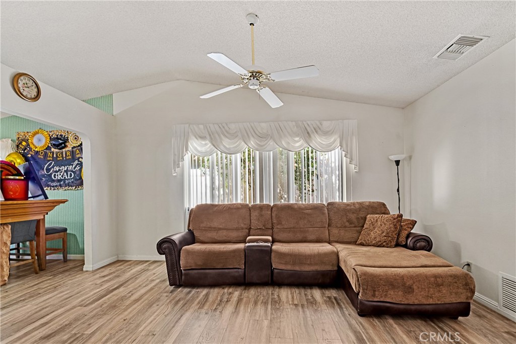 2906 Summer Set Circle Banning, CA 92220 - Photo 10 of 43 a living room with furniture and a large window