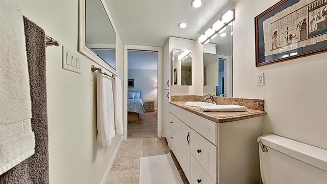 a bedroom with a bed and a couch