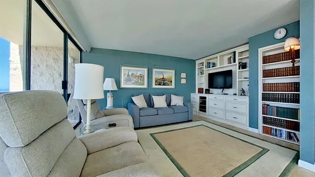 a living room with furniture and a rug