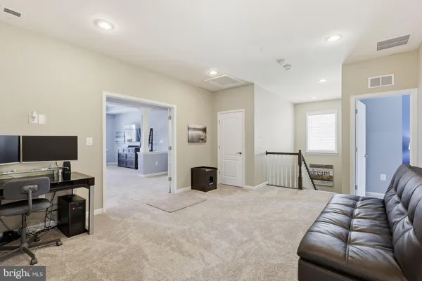 a view of a room with windows and gate