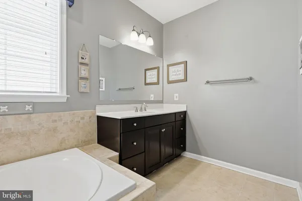 a bathroom with a toilet and a bathtub