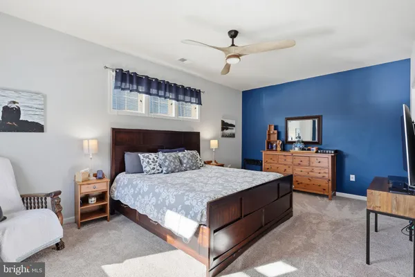a view of a patio with table and chairs