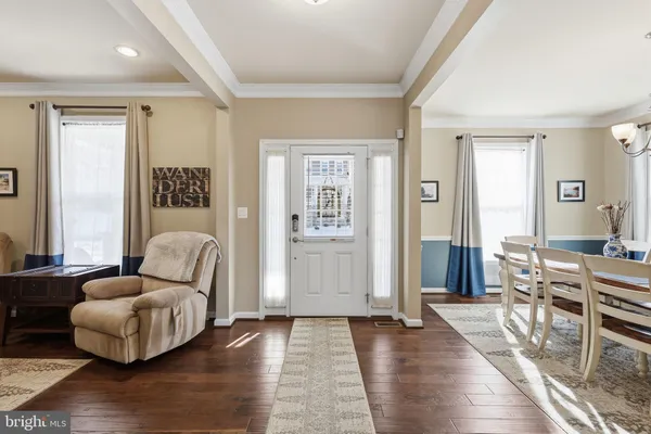 a living room with furniture and a rug