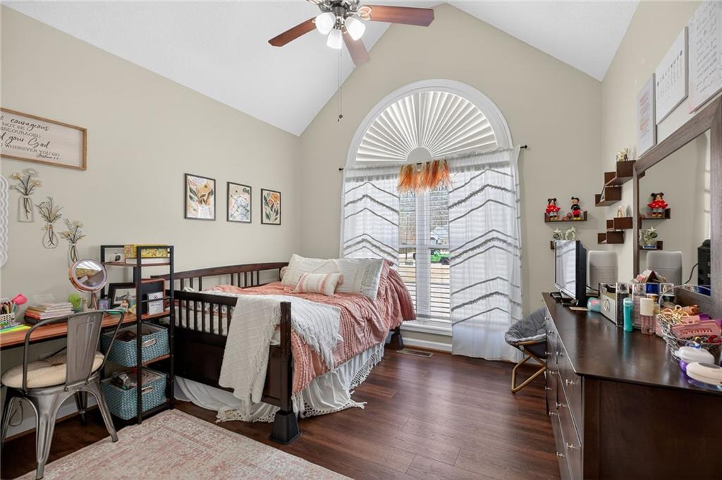 143 Autumn Run Place Villa Rica, GA 30180 - Photo 15 of 30 a bedroom with furniture and a bed