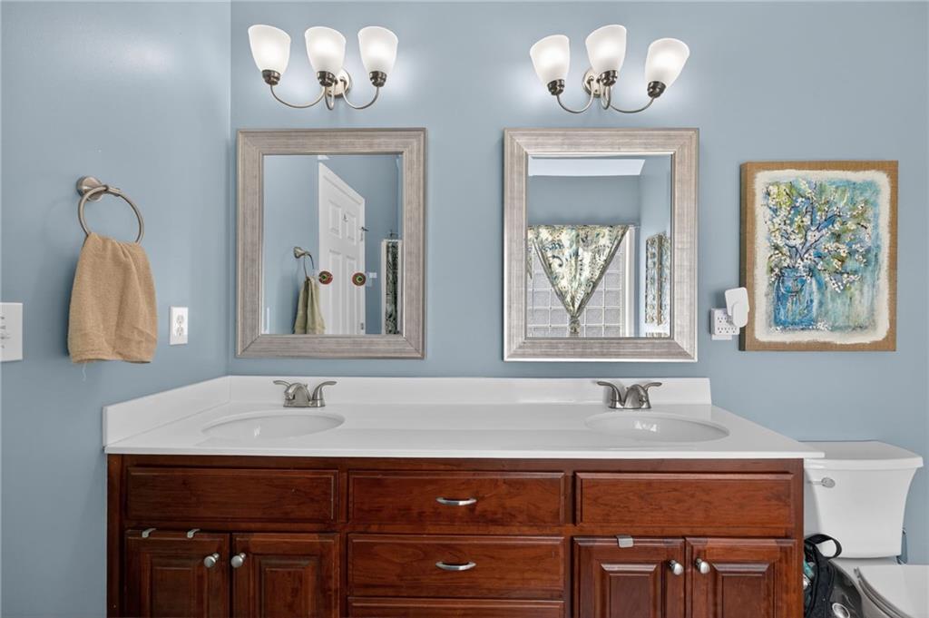 143 Autumn Run Place Villa Rica, GA 30180 - Photo 16 of 30 a bathroom with a sink and a mirror