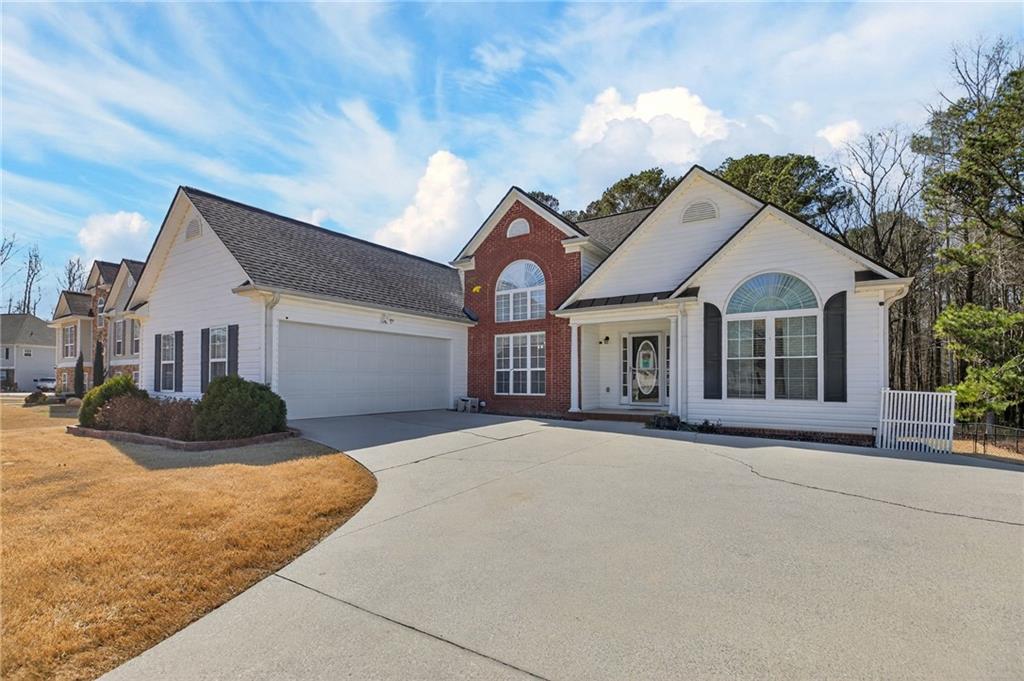 143 Autumn Run Place Villa Rica, GA 30180 - Photo 2 of 30 a front view of a house with a yard and garage
